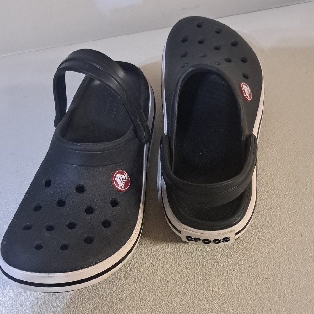 CROCS Kids Black Slip-On Clogs with White Trim and Red Logo